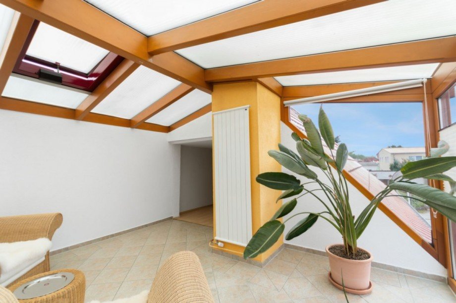 Wintergarten mit Zugang zum Wohnzimmer im DG Einfamilienhaus Dassow
